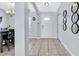 Welcoming entryway with tile flooring and access to the dining room at 199 Maple Dr, Kissimmee, FL 34759