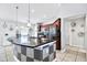 Spacious kitchen with stainless appliances and a large granite island at 199 Maple Dr, Kissimmee, FL 34759