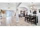 Open-concept living and dining area with tile flooring and neutral decor at 199 Maple Dr, Kissimmee, FL 34759