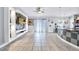 Bright living room featuring tile floors, built-in shelving for a tv, and sliding glass doors at 199 Maple Dr, Kissimmee, FL 34759