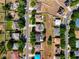 Bird's eye view of homes in a neighborhood showcasing a pool and residential street at 1930 Knollcrest Dr, Clermont, FL 34711