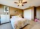 Comfortable bedroom with carpeted floors, closet, and ceiling fan at 1930 Knollcrest Dr, Clermont, FL 34711