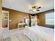 Cozy bedroom features neutral-toned walls, soft carpeting, and a functional desk area at 1930 Knollcrest Dr, Clermont, FL 34711