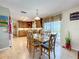 Dining area with tile flooring and pool view through glass door, close to kitchen at 1930 Knollcrest Dr, Clermont, FL 34711