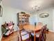 Elegant dining room with wood table and chairs, china cabinet, and decor creating a perfect setting for meals at 1930 Knollcrest Dr, Clermont, FL 34711