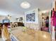 Dining room featuring tile floors, seating for six, and open access to the living room at 1930 Knollcrest Dr, Clermont, FL 34711