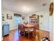 Bright dining room featuring a classic wooden table set, chandelier, and a decorative china cabinet at 1930 Knollcrest Dr, Clermont, FL 34711