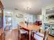 Open dining room with wood floors connecting to other living areas, offering a harmonious flow at 1930 Knollcrest Dr, Clermont, FL 34711