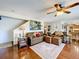 Inviting living room boasting hardwood floors, staircase, and comfortable seating arrangements at 1930 Knollcrest Dr, Clermont, FL 34711