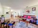 Spacious living room seamlessly connects to the dining area, offering a welcoming and cohesive living space at 1930 Knollcrest Dr, Clermont, FL 34711