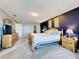 Bright main bedroom boasts soft carpeting, a calming color palette, and a spacious walk-in closet at 1930 Knollcrest Dr, Clermont, FL 34711