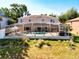 Backyard of house showcasing a screened-in pool and patio with outdoor furniture at 1930 Knollcrest Dr, Clermont, FL 34711