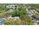 This is an aerial view of the neighborhood, showing tree-lined streets and well-maintained homes at 2074 King Richards Ct, Orange City, FL 32763