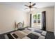 Inviting bedroom featuring a large window, vaulted ceilings, contemporary decor, and neutral tones at 2074 King Richards Ct, Orange City, FL 32763
