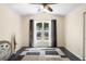Charming bedroom featuring a large window, vaulted ceilings, contemporary decor, and neutral tones at 2074 King Richards Ct, Orange City, FL 32763