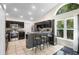 Bright kitchen boasts granite countertops, stainless appliances, and backyard views at 2074 King Richards Ct, Orange City, FL 32763