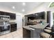 Modern kitchen with stainless steel appliances, bar top, and lots of cabinet space at 2074 King Richards Ct, Orange City, FL 32763