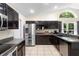 Spacious kitchen features stainless steel appliances, and ample counter space at 2074 King Richards Ct, Orange City, FL 32763