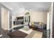 Open concept living room with vaulted ceiling, modern light fixture and access to the kitchen area at 2074 King Richards Ct, Orange City, FL 32763