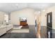 Spacious living room with high ceilings, polished floors, and a seamless flow to the other areas of the house at 2074 King Richards Ct, Orange City, FL 32763