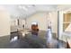 Inviting living room with stylish sofa and large window, polished floors, and a seamless flow to the outdoors at 2074 King Richards Ct, Orange City, FL 32763