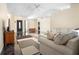 Spacious living room flowing into other rooms, featuring neutral décor, and tile floors at 2074 King Richards Ct, Orange City, FL 32763