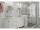 This bathroom boasts a glass shower with decorative tile and a white double sink vanity at 212 Ficus St, Celebration, FL 34747