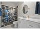 Bathroom featuring a glass shower, white vanity with marble countertop, and modern fixtures at 212 Ficus St, Celebration, FL 34747