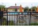Community pool surrounded by lounge chairs and umbrellas in fenced in area at 212 Ficus St, Celebration, FL 34747