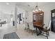 Bright dining room with wood table, stylish chandelier, and open layout to the living area at 212 Ficus St, Celebration, FL 34747