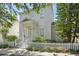 Charming two-story home featuring a welcoming front porch and a well-maintained picket fence at 212 Ficus St, Celebration, FL 34747