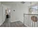 Hallway with wood floors and staircase at 212 Ficus St, Celebration, FL 34747