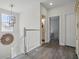 Hallway with wood floors and access to the bathroom and bedroom at 212 Ficus St, Celebration, FL 34747