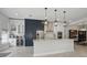Stylish kitchen with custom cabinets, large island, stainless steel appliances, and modern lighting at 212 Ficus St, Celebration, FL 34747