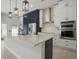 Modern kitchen features an oversized island, stainless steel appliances, and beautiful countertops at 212 Ficus St, Celebration, FL 34747