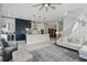Inviting open-concept layout with kitchen, living area, and staircase in a modern design at 212 Ficus St, Celebration, FL 34747