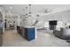 Open concept floorplan with the living room showing large kitchen island and staircase at 212 Ficus St, Celebration, FL 34747