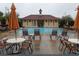 Inviting community pool with ample seating and a charming building, perfect for relaxation and recreation at 212 Ficus St, Celebration, FL 34747