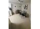 Warm dining area featuring a wood table, neutral paint, and modern wall decor at 2130 Cascades Blvd # 108, Kissimmee, FL 34741