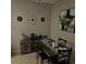 Warm dining area featuring a wood table, neutral paint, and modern wall decor at 2130 Cascades Blvd # 108, Kissimmee, FL 34741