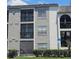 Three story condo building with screened in patios and handicap parking at 2130 Cascades Blvd # 108, Kissimmee, FL 34741