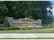 Stone community sign with fountain reads Victoria Oaks at 219 Duke Dr, Deland, FL 32724