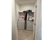 Efficient laundry room featuring a washer, dryer, and wire shelving for storage at 219 Duke Dr, Deland, FL 32724