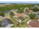 Aerial view of a lovely home with a screened pool, fenced yard, and well-maintained landscaping in a quiet neighborhood at 2289 Jessica Ln, Kissimmee, FL 34744