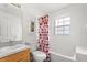 Bathroom with tiled floors, a shower-tub combo, vanity and storage cabinet at 2289 Jessica Ln, Kissimmee, FL 34744