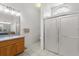 Bright bathroom with updated shower featuring seamless glass doors at 2289 Jessica Ln, Kissimmee, FL 34744