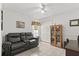 Bedroom featuring a cozy seating area, tiled flooring, and a closet for ample storage at 2289 Jessica Ln, Kissimmee, FL 34744