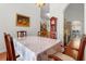 Inviting dining room with hardwood floors, chandelier lighting, and access to the kitchen at 2289 Jessica Ln, Kissimmee, FL 34744
