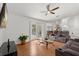 Bright living room with French doors, ceiling fan and modern furniture creating a welcoming space at 2289 Jessica Ln, Kissimmee, FL 34744