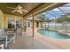 Outdoor pool and patio area featuring a seating area with a dining table at 2289 Jessica Ln, Kissimmee, FL 34744